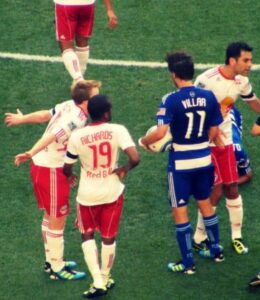 Soccer Players arguing with the ref
