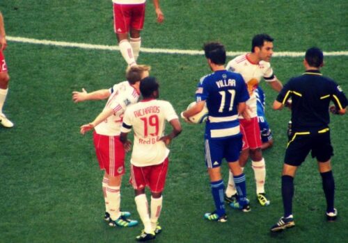 Soccer Players arguing with the ref