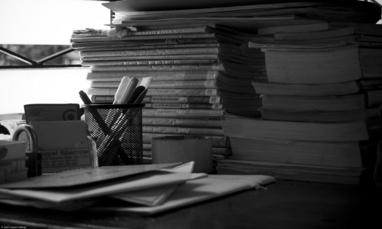 stack of books on desk