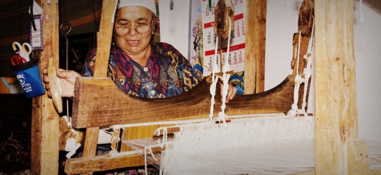 woman at a weaving loom connectedness