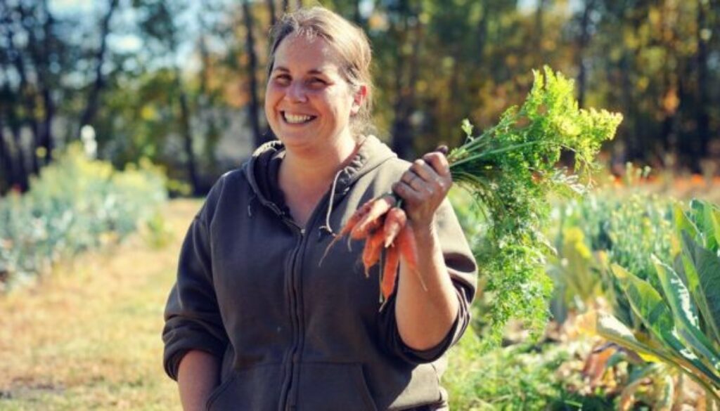 a developer holding carrot from the garden