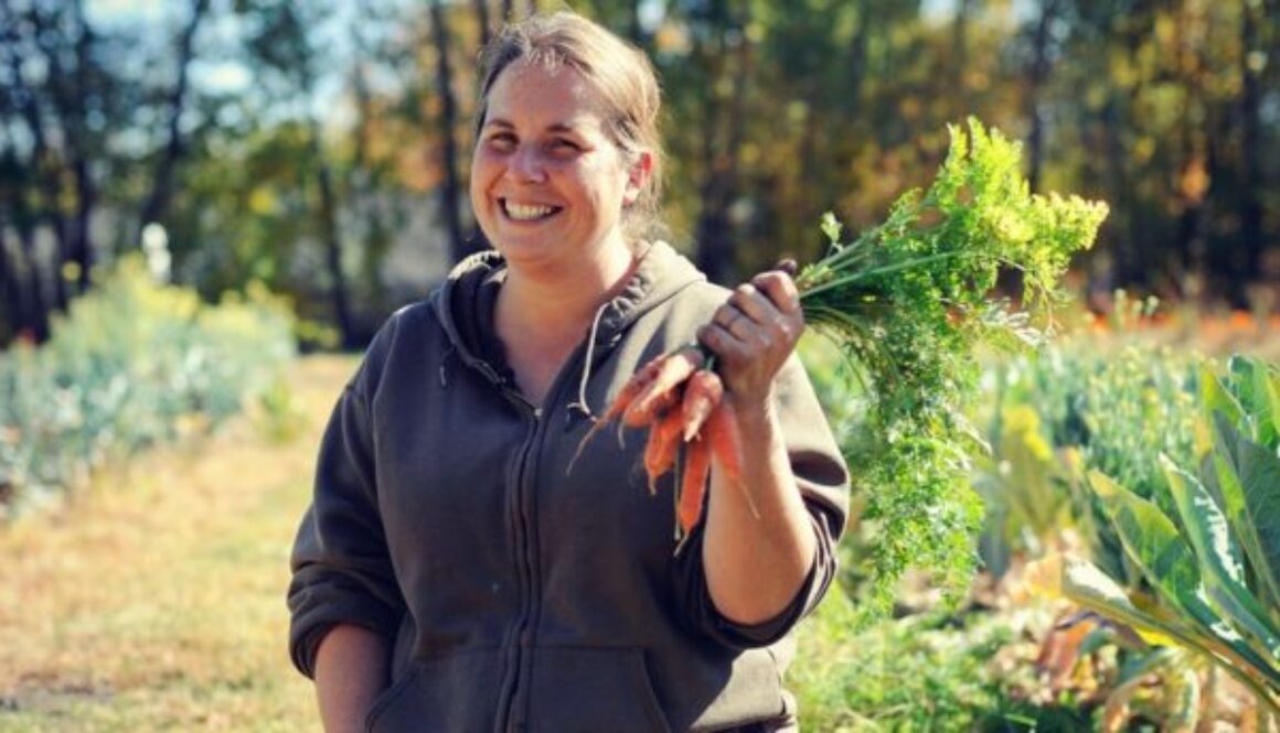 a developer holding carrot from the garden