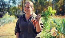 a developer holding carrot from the garden