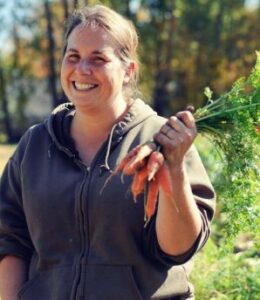 a developer holding carrot from the garden