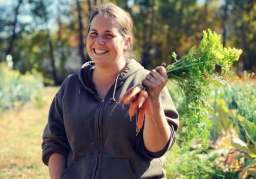 a developer holding carrot from the garden