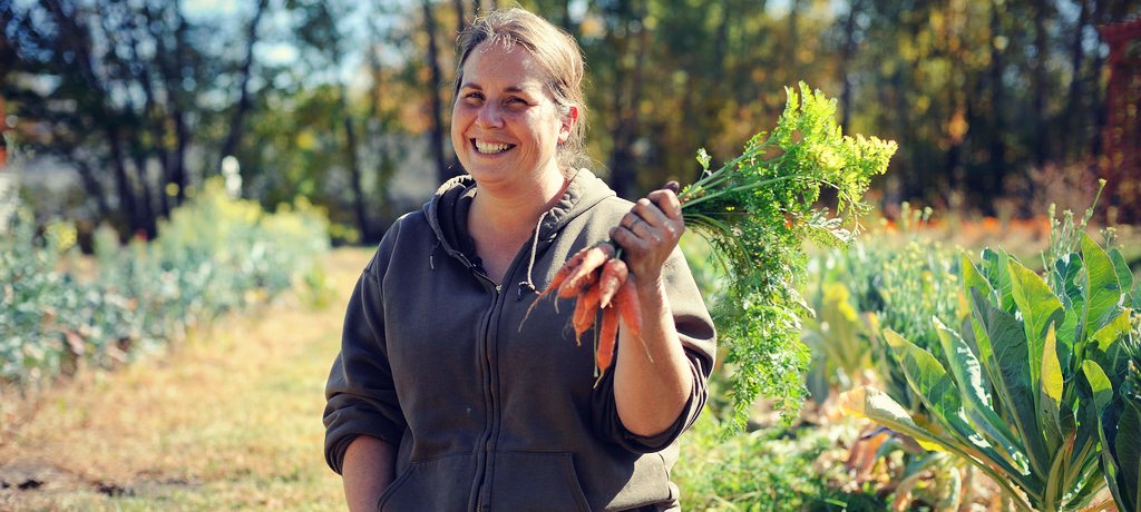 a developer holding carrot from the garden