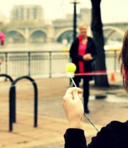 team with ball and string along river