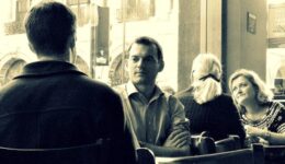 people talking in a cafe