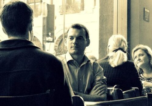 people talking in a cafe
