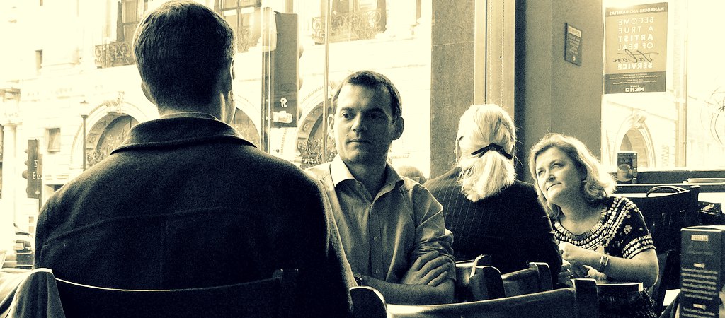 people talking in a cafe