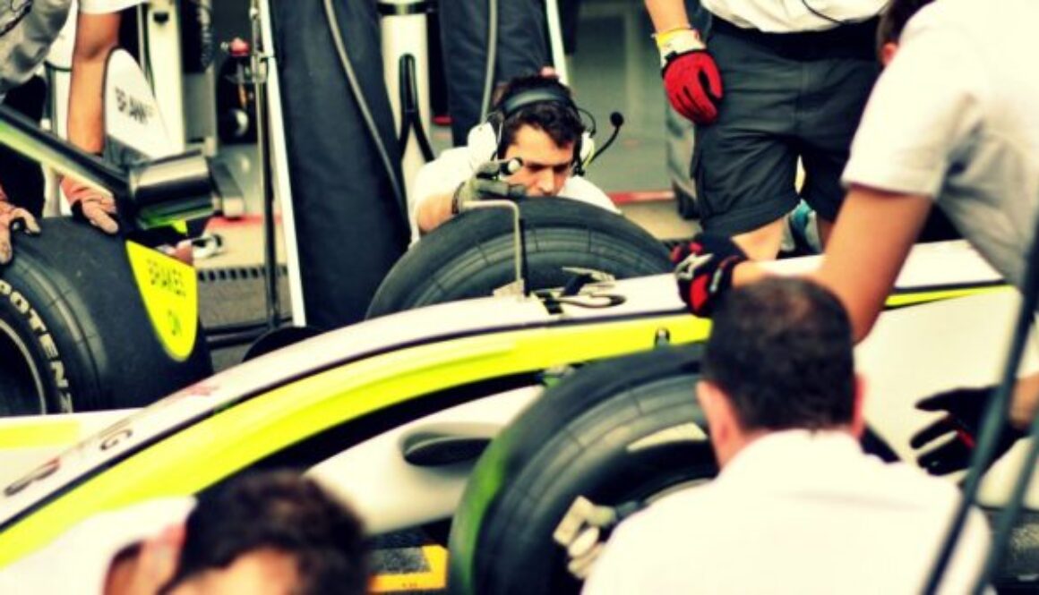 pit crew working on formula one racer