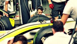 pit crew working on formula one racer