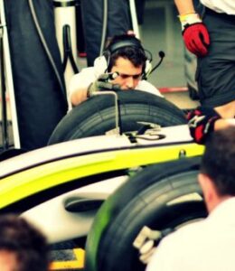 pit crew working on formula one racer