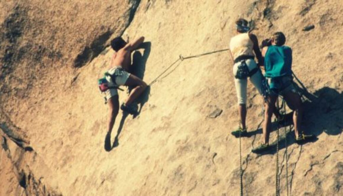 strong people rock climbing