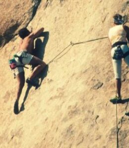 strong people rock climbing