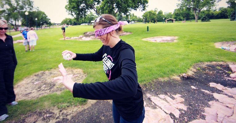 Blindfold ball drop participant