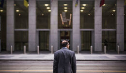 CEO-standing-in-front-of-a-building