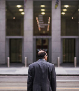 CEO-standing-in-front-of-a-building
