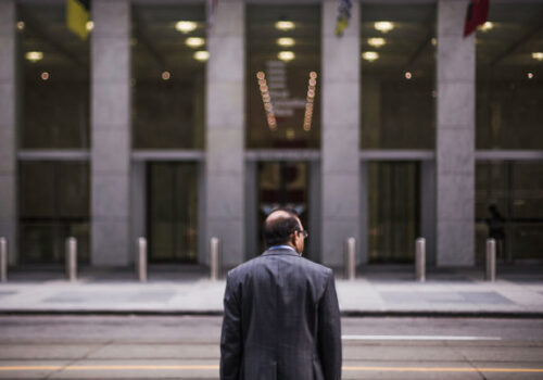 CEO-standing-in-front-of-a-building