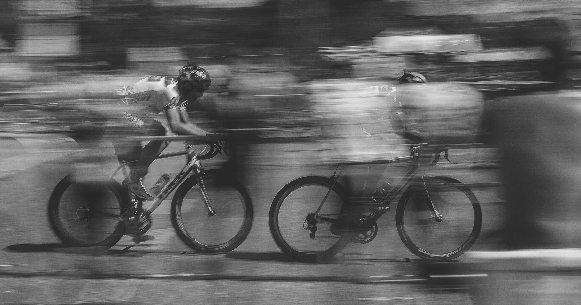 two cyclists racing in competition