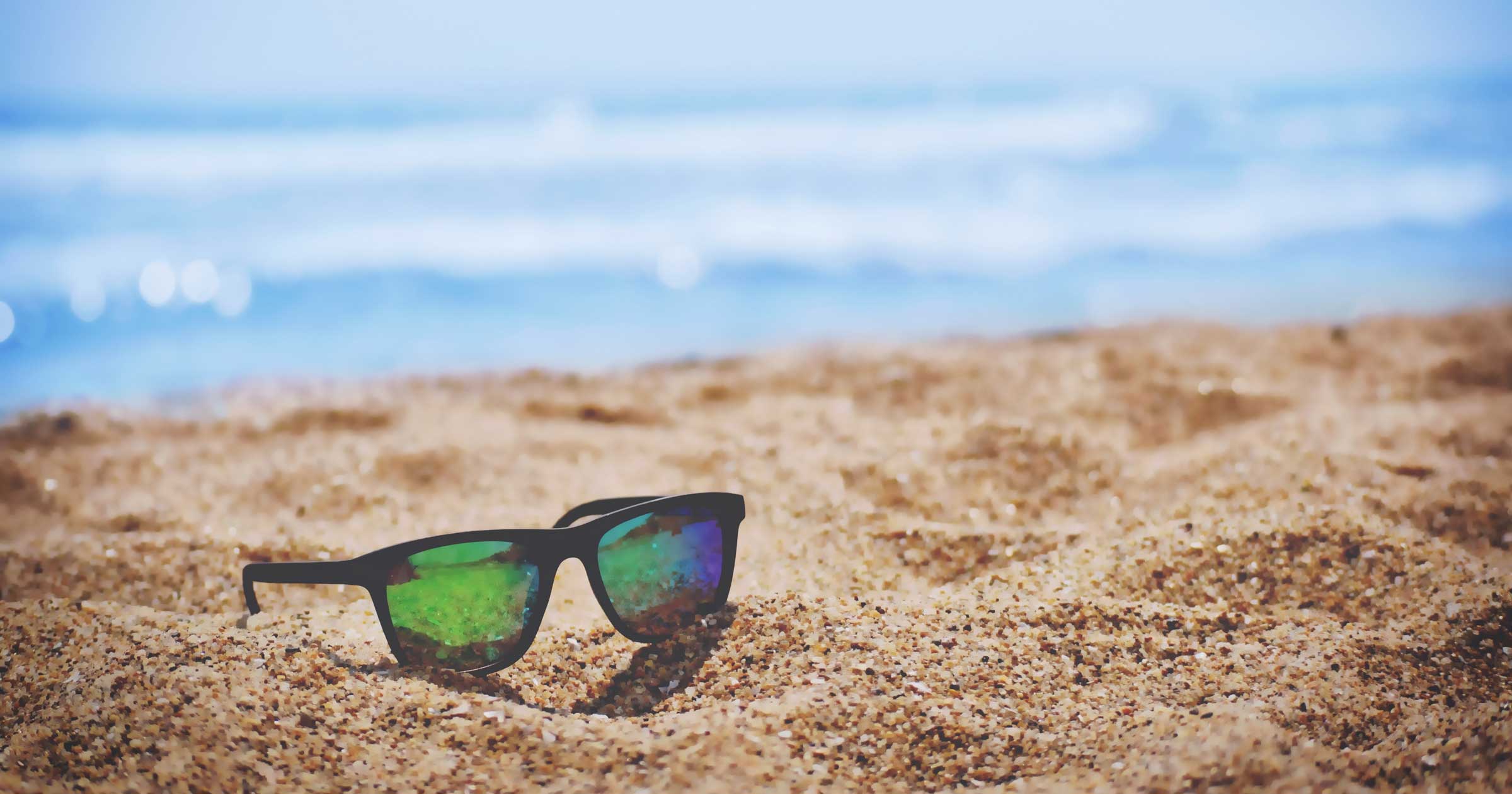 sun-glasses-on-the-beach