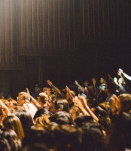 conference-crowd-raising-their-hands